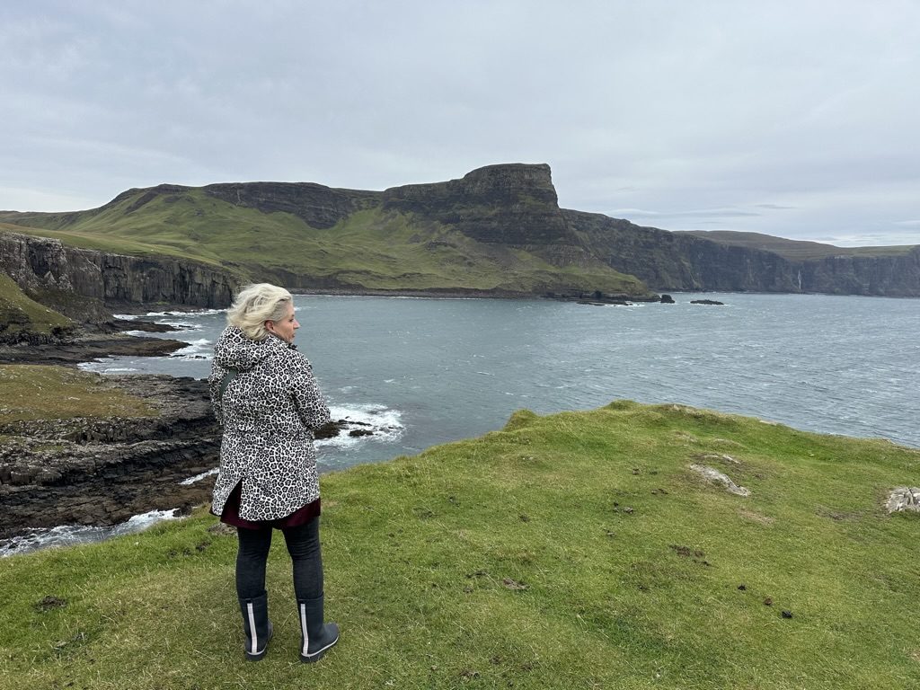 Christy overlooking the Scottish cliffs and sea